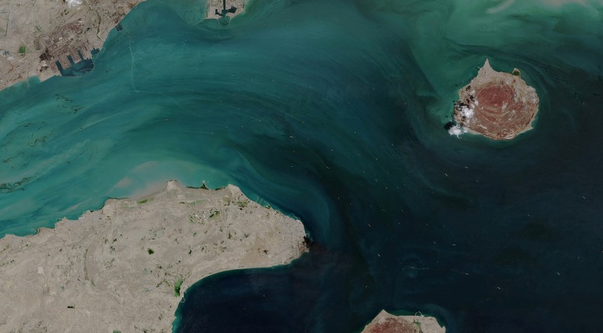 Container Ship Struck in Strait of Hormuz Amid Conflicting Claims Over Waterway Status